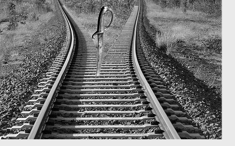 Divorce represented by a Train track image cut in half by a medieval sword.